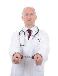 doctor with a stethoscope in handcuffs.