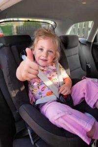 child sitting in a car seat