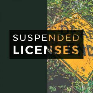 suspended licenses text overlaid on dead end sign and dark green background