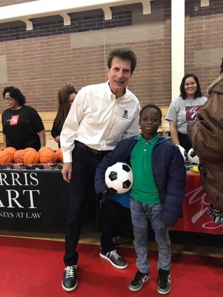 morris bart and child at iheart's toy drive
