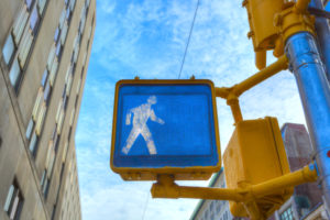 A picture of a pedestrian walk signal.