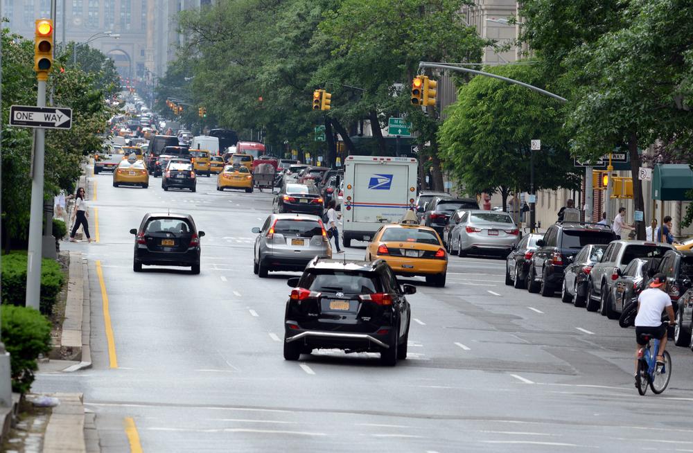 car changing lanes in city traffic