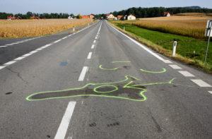 chalk outline of a motorcycle on the highway