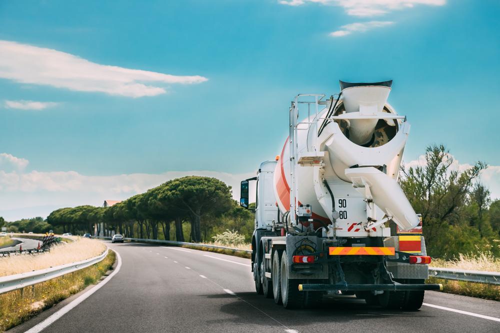 xconcrete truck driving down the road
