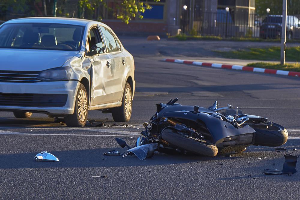 motorcycle smashed after collision with car