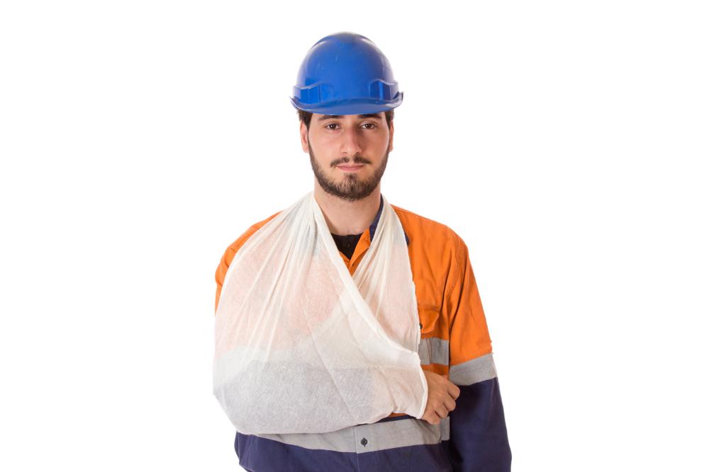 construction laborer with arm in sling