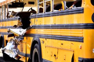 damaged school bus after collision