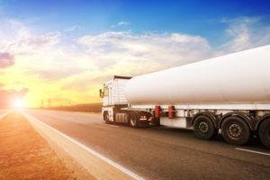 fuel tanker truck ships fuel across countryside road