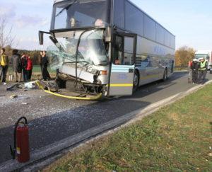 passengers stand outside after bus wreck