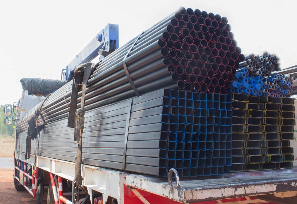 truck carrying steel cargo for construction