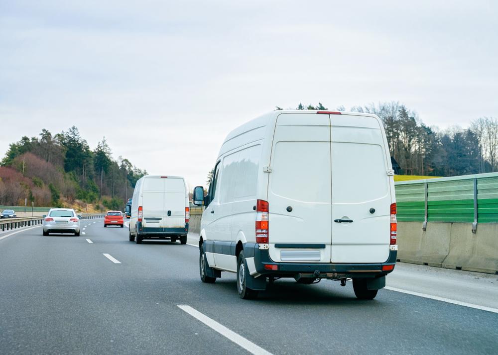 vans travel along highway to make deliveries