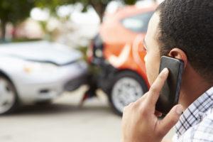 man calls for assistance after car wreck