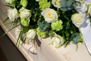 flower arrangement on a coffin