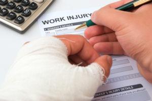 injured worker filling out claim form