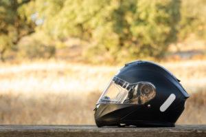 A motorcycle helmet sits without its rider.