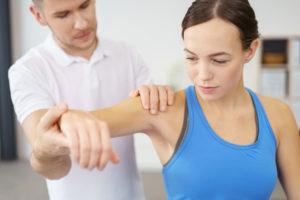 A patient receives physical therapy for an injury.