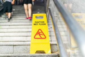 wet floor sign on steps