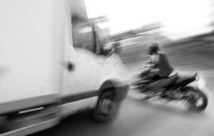 motion-blurred image of impending motorcycle crash
