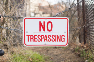 no trespassing sign on a gate