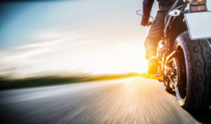 motorcyclist at sunset