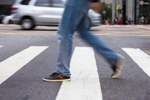 person walking in a crosswalk
